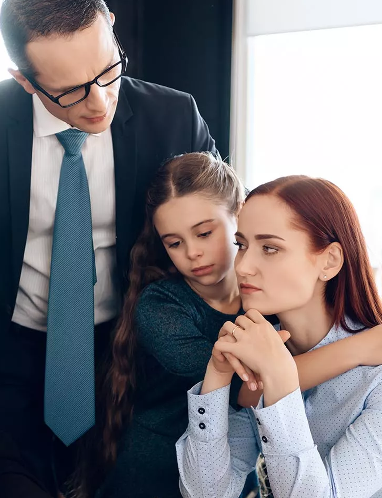 couple with a child discussing child support with attorney