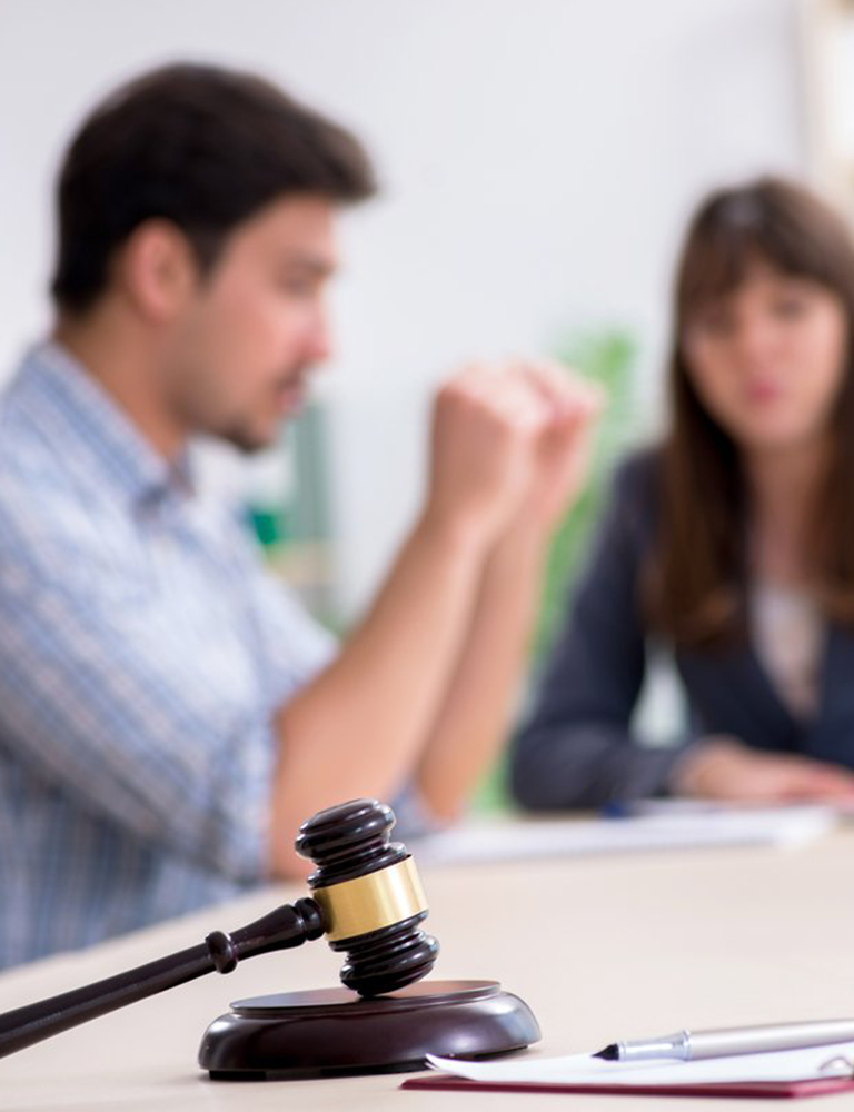 couple discussing civil rights in a lawyer office