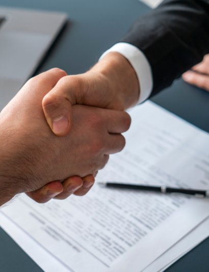 shaking hands for agreement in attorney office